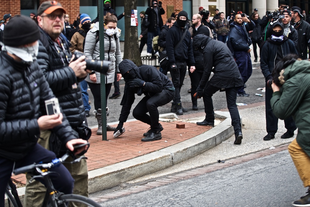 Bricks being pulled from the sidewalk on K steet during the protest – Daily Caller – Grae Stafford