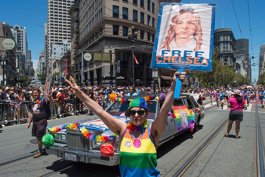 Woman holds a "Free Chelsea Manning" poster during a San Francisco gay pride parade (Getty Images)