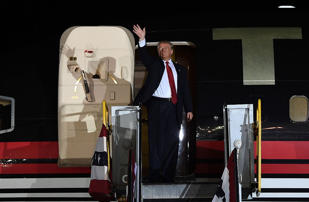 Donald Trump boards his plane (Photo credit: JEWEL SAMAD/AFP/Getty Images)