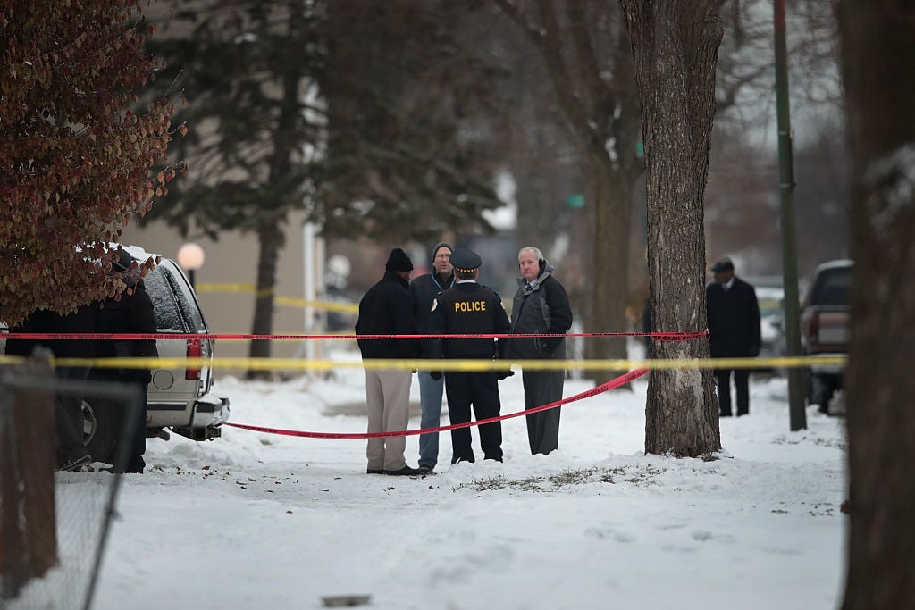 Police investigate the scene of a quadruple homicide on Chicago's Southside on December 17, 2016 (Getty Images)