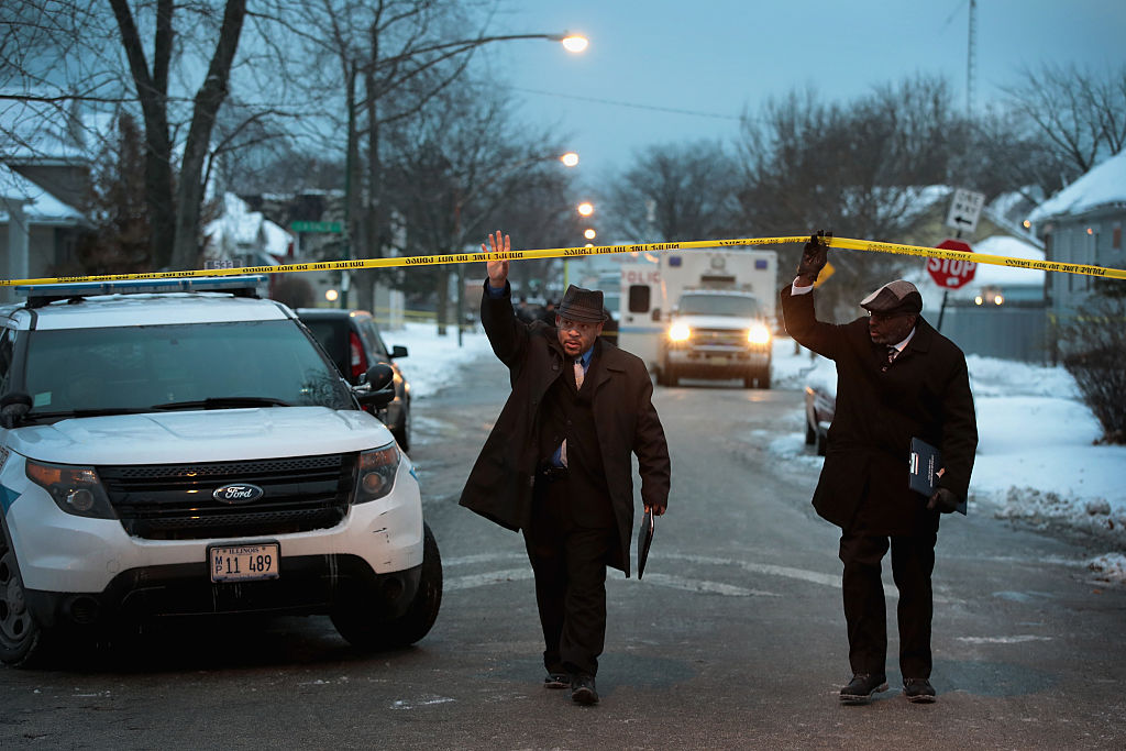 Police investigate the scene of a quadruple homicide on Chicago's Southside on December 17, 2016 (Getty Images)