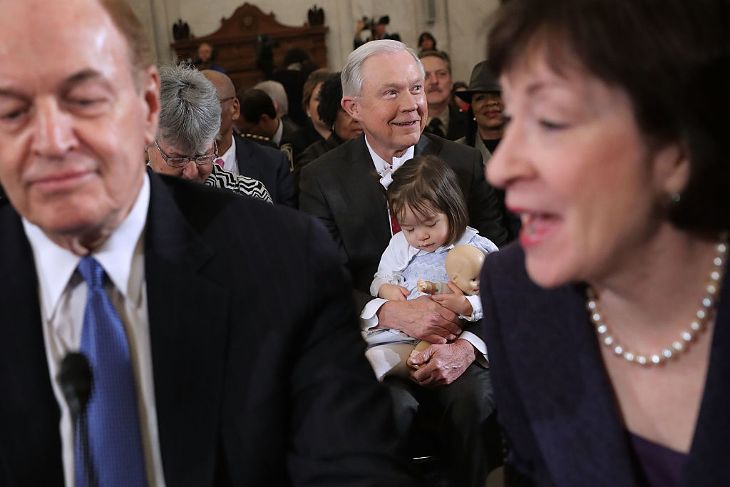 Jeff Sessions sits with his granddaughter on Capitol Hill (Getty Images)
