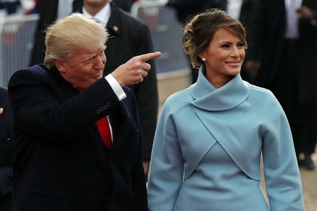 President Donald Trump points to supporters as he walks the parade route with first lady Melania Trump during the Inaugural Parade on January 20, 2017 in Washington, D.C. (Photo by Drew Angerer/Getty Images)