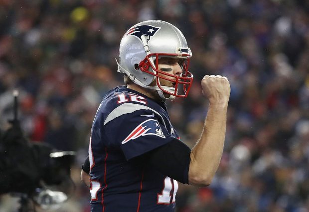 FOXBORO, MA - JANUARY 22: Tom Brady #12 of the New England Patriots reacts after throwing a touchdown pass to Chris Hogan #15 (not pictured) during the second quarter against the Pittsburgh Steelers in the AFC Championship Game at Gillette Stadium on January 22, 2017 in Foxboro, Massachusetts. (Photo by Elsa/Getty Images)