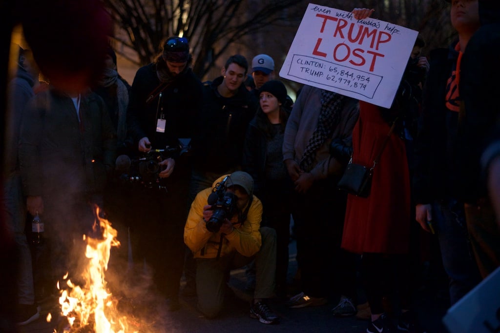 Protesters set fire to inauguration shirts in the streets – Daily Caller – Abbey Jaroma