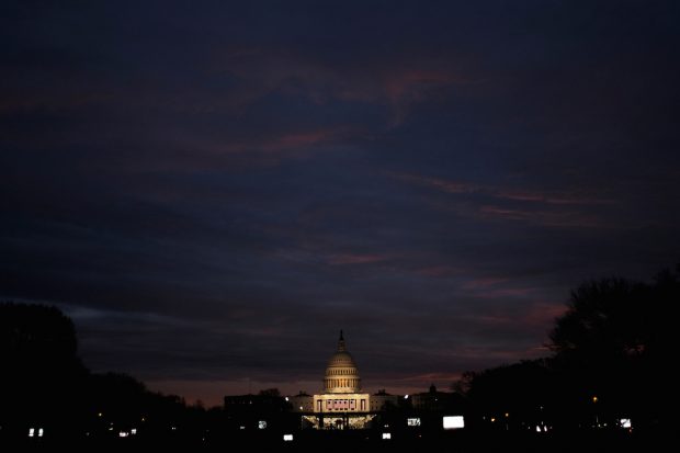 The sun begins to rise over the U.S. Capitol on the National Mall before President-elect Donald Trump is to be sworn in in Washington, January 20, 2017. REUTERS/James Lawler Duggan