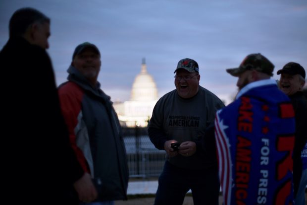 U.S. President-elect Donald Trump supporters gather as the sun begins to rise over the U.S. Capitol on the National Mall before Trump is to be sworn in in Washington, U.S., January 20, 2017. REUTERS/James Lawler Duggan - RTSWGLN