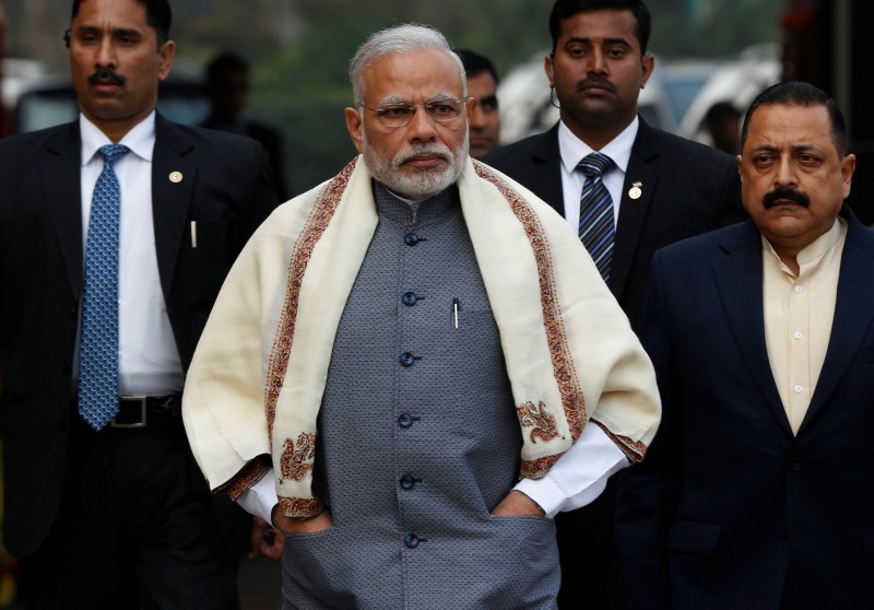 Prime Minister Narendra Modi walks to speak with the media as he arrives at the parliament house to attend the first day of the budget session, in New Delhi, India, January 31, 2017. REUTERS/Adnan Abidi