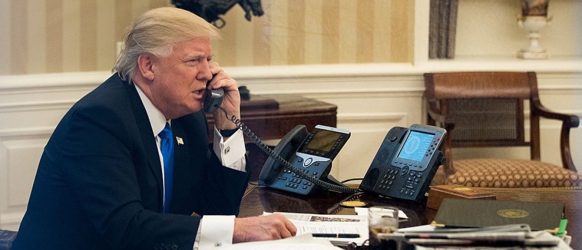 WASHINGTON, DC - JANUARY 28: President Donald Trump speaks on the phone with Australian Prime Minister Malcolm Turnbull in the Oval Office of the White House. On Saturday, President Trump is making several phone calls with world leaders from Japan, Germany, Russia, France and Australia. (Photo by Drew Angerer/Getty Images)