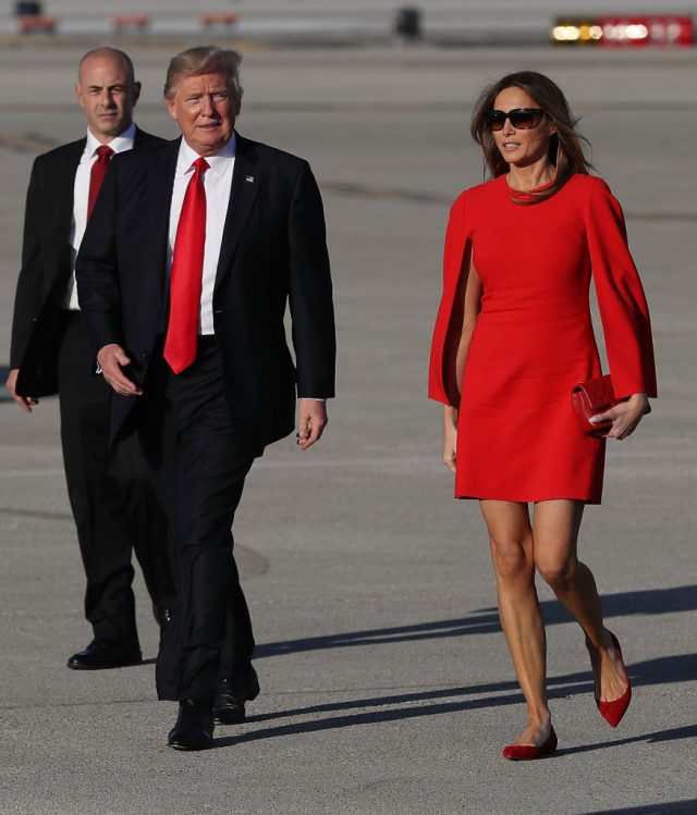 President Donald Trump walks with his wife Melania Trump on the tarmac after he arrived on Air Force One at the Palm Beach International Airport for a visit to his Mar-a-Lago Resort for the weekend on February 3, 2017 in Palm Beach, Florida. (Photo by Joe Raedle/Getty Images)