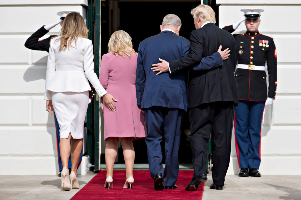 WASHINGTON, D.C. - FEBRUARY 15: (AFP-OUT) U.S. President Donald Trump (R), Israeli Prime Minister Benjamin Netanyahu (2nd R) and their wives first lady Melania Trump (L) and Sara Netanyahu walk into the White House on February 15, 2017 in Washington, D.C. Netanyahu is trying to recalibrate ties with the new U.S. administration after eight years of high-profile clashes with former President Barack Obama, in part over Israel's policies toward the Palestinians. (Photo by Andrew Harrer-Pool/Getty Images)