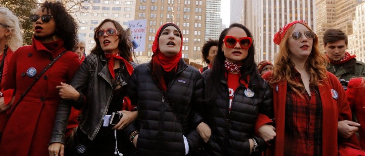 Organizers Linda Sarsour (C), Carmen Perez (2nd R) and Bob Bland (R) lead during a 'Day Without a Woman' march on International Women's Day in New York, U.S., March 8, 2017. REUTERS/Lucas Jackson