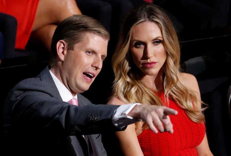 FILE PHOTO: Donald Trump's son Eric Trump and his wife Lara Yunaska watch the proceedings during the third day of the Republican National Convention in Cleveland, Ohio, U.S., July 20, 2016. REUTERS/Carlo Allegri/File Photo