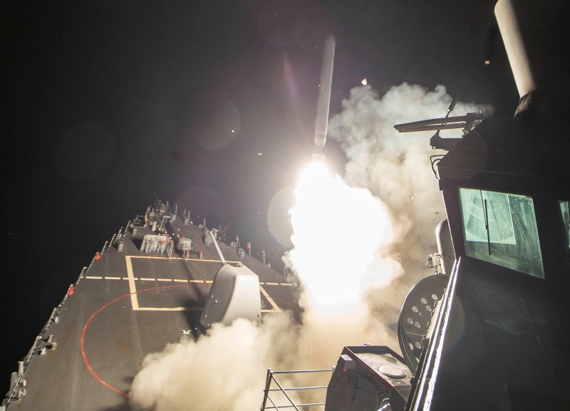 U.S. Navy guided-missile destroyer USS Ross (DDG 71) fires a tomahawk land attack missile in Mediterranean Sea which U.S. Defense Department said was a part of cruise missile strike against Syria on April 7, 2017. Robert S. Price/Courtesy U.S. Navy/Handout via REUTERS 