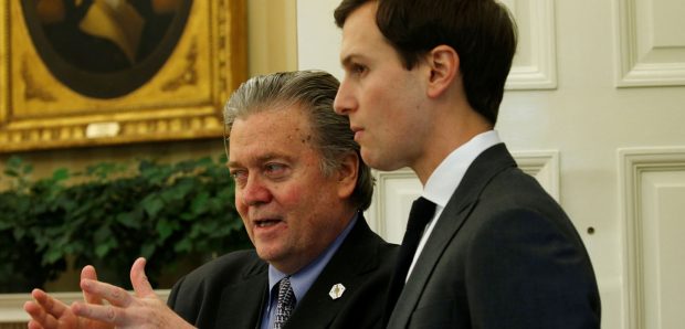 White House chief strategist Steve Bannon (L) and senior advisor Jared Kushner speak after U.S. President Donald Trump signed an executive order at the White House in Washington, U.S. February 3, 2017. (PHOTO: REUTERS/Kevin Lamarque)