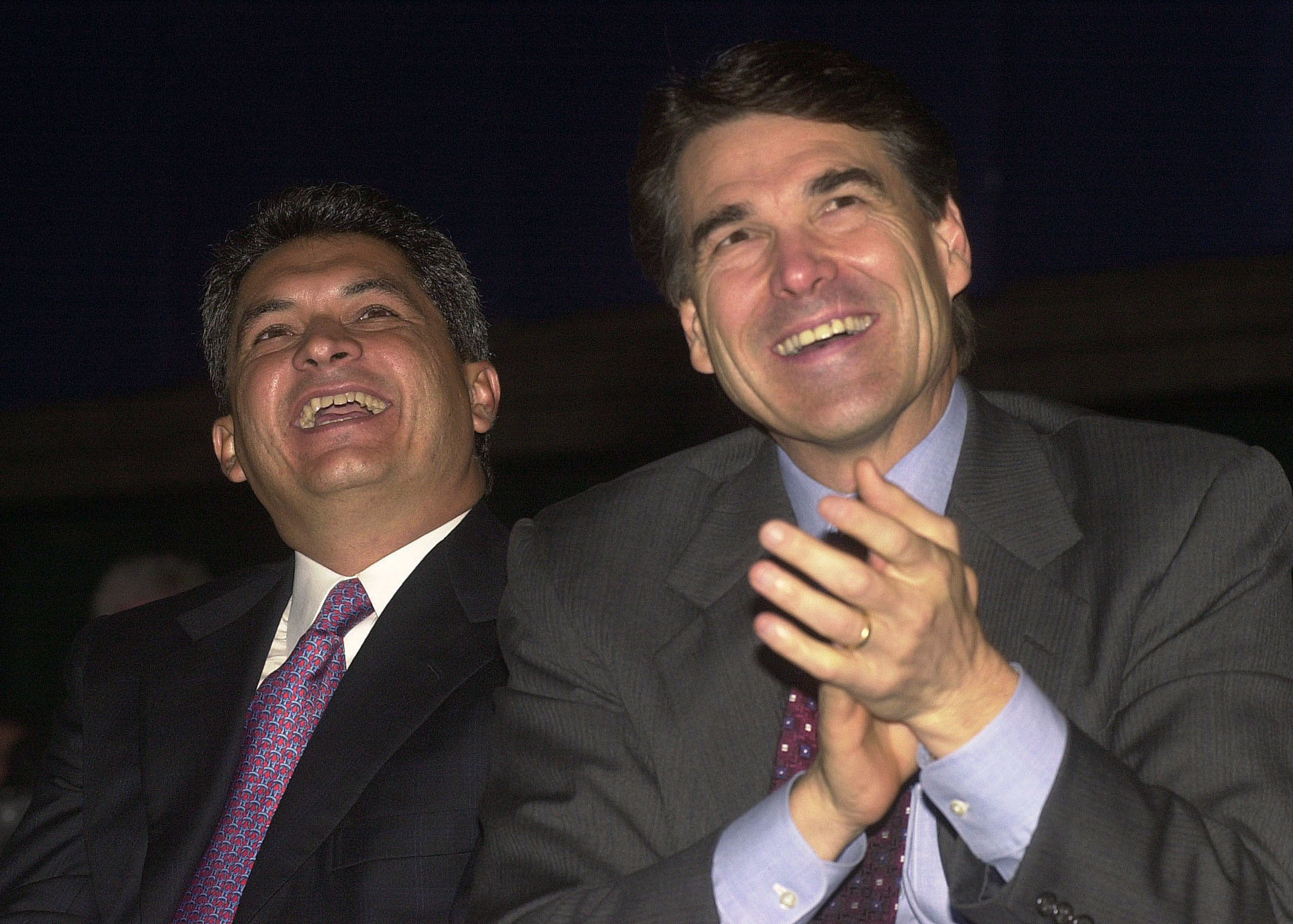 Governor Tomas Yarrington (L) of the state of Tamaulipas, Mexico, and Texas Governor Rick Perry listen to remarks during the U.S. and Mexico Border Summit August, 22, 2001 in Edinburg, TX. (Photo by Alicia Wagner Calzada/Getty Images)
