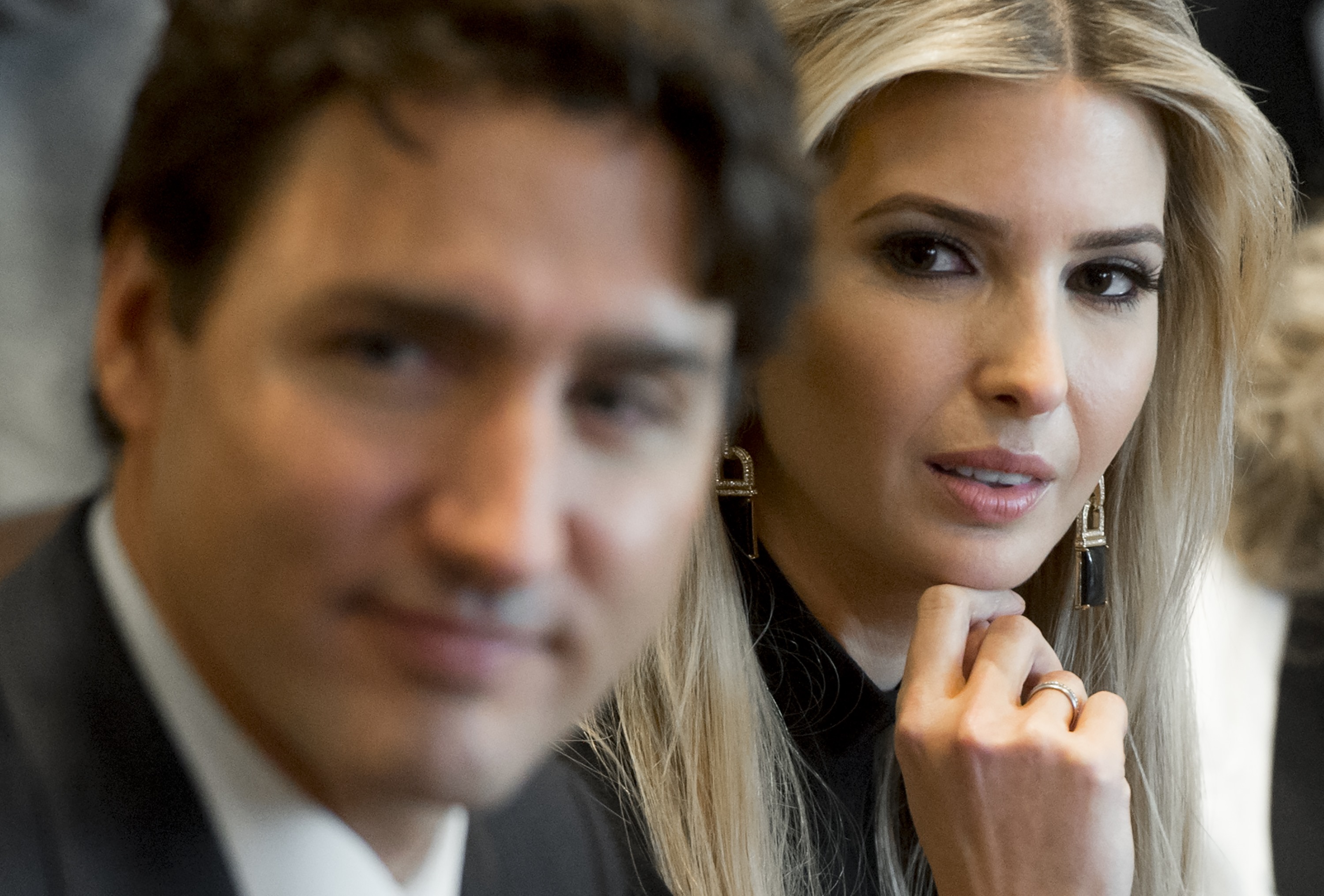 Canadian Prime Minister Justin Trudeau sits alongside Ivanka Trump (R), daughter of US President Donald Trump, during a roundtable discussion on women entrepreneurs and business leaders in the Cabinet Room of the White House in Washington, DC, February 13, 2017. SAUL LOEB/AFP/Getty Images