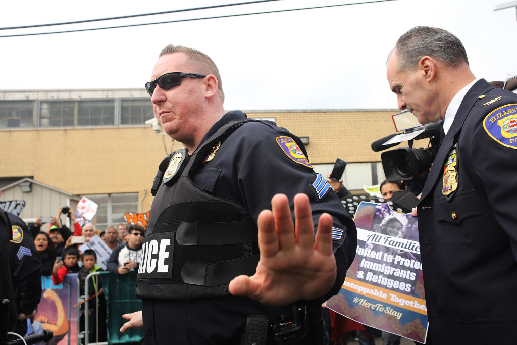 Police remove a protester from ICE detention center in NJ (Getty Images)