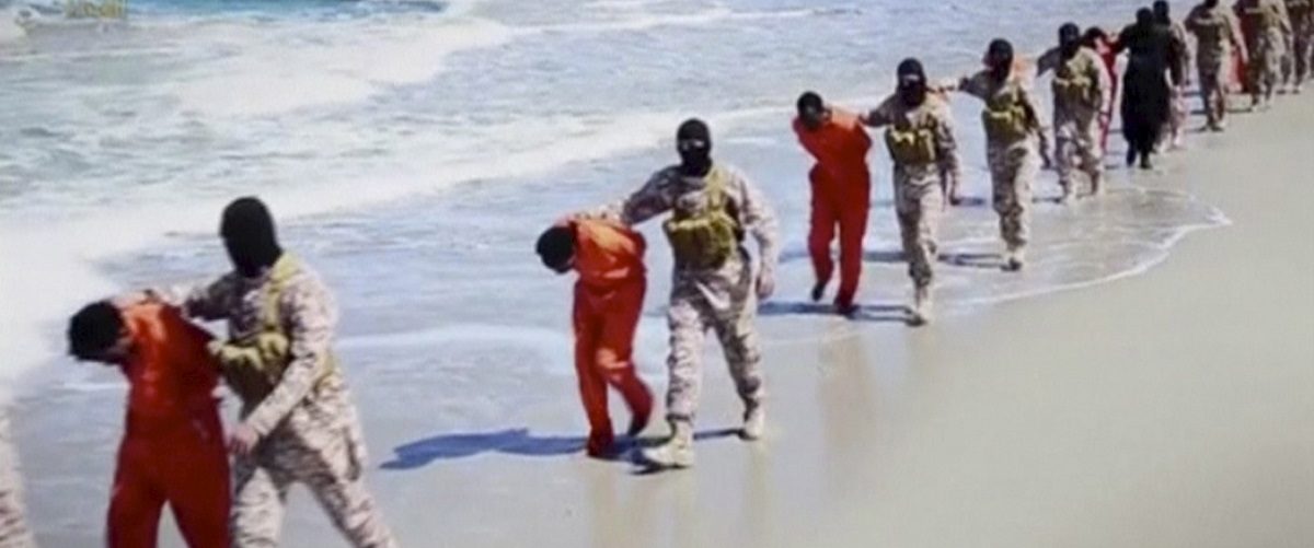Islamic State militants lead what are said to be Ethiopian Christians along a beach in Wilayat Barqa, in this still image from an undated video made available on a social media website