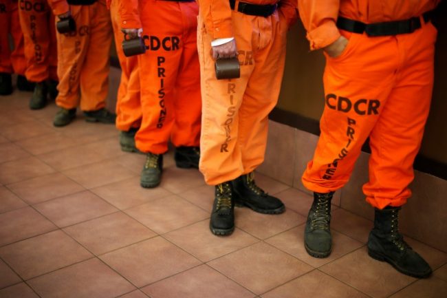 FILE PHOTO: Prison inmates wearing firefighting boots line up for breakfast at Oak Glen Conservation Fire Camp #35 in Yucaipa, California, U.S. November 6, 2014. Picture taken November 6, 2014. REUTERS/Lucy Nicholson/File photo