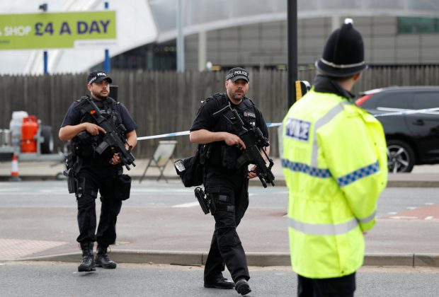 Armed police stand near the Manchester Arena in Manchester, Britain May 24, 2017. REUTERS/Peter Nicholls 