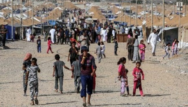 Nearly half of Mosul's population has fled the city to escape the violence. Thousands more civilians perished in the eight month conflict. (MOHAMED EL-SHAHED/AFP/Getty Images)