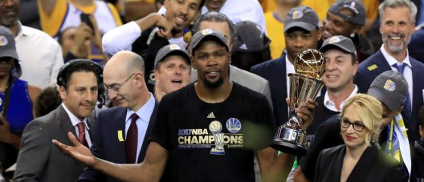 Kevin Durant #35 of the Golden State Warriors celebrates with the Bill Russell NBA Finals Most Valuable Player Award after defeating the Cleveland Cavaliers 129-120 in Game 5 to win the 2017 NBA Finals at ORACLE Arena on June 12, 2017 in Oakland, California. NOTE TO USER: User expressly acknowledges and agrees that, by downloading and or using this photograph, User is consenting to the terms and conditions of the Getty Images License Agreement. (Photo by Ronald Martinez/Getty Images)