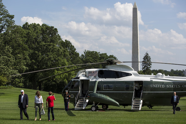 WASHINGTON, DC - JUNE 18: President Donald Trump, First Lady Melania Trump and their son, Barron Trump, cross the South Lawn after arriving at The White House on June 18, 2017 in Washington, D.C. President Trump spent the weekend at Camp David. (Photo by Zach Gibson/Getty Images)
