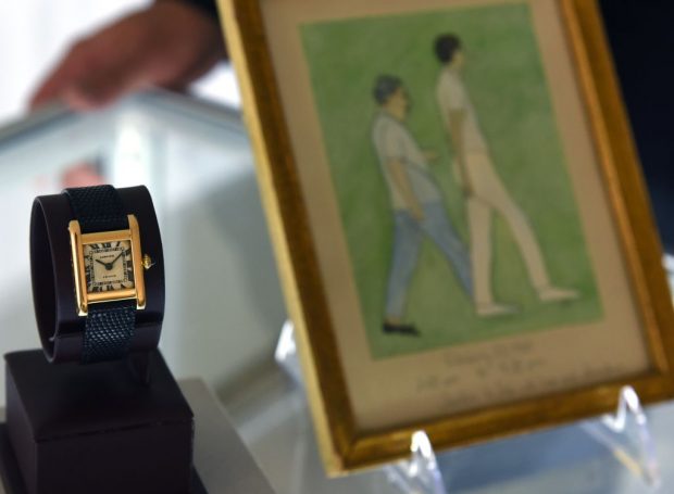 Jackie Kennedy's watch and an original painting by the First Lady on display. (Photo:Getty)
