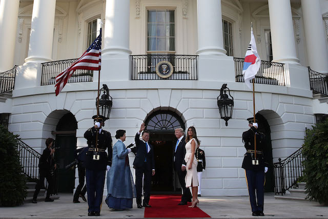 WASHINGTON, DC - JUNE 29: U.S. President Donald Trump (3rd L) and first lady Melania Trump (R) welcome South Korean President Moon Jae-in (2nd L) and his wife Kim Jung-sook (L) during an arrival at the South Portico of the White House June 29, 2017 in Washington, DC. President Moon is on a three-day visit in Washington. (Photo by Alex Wong/Getty Images)