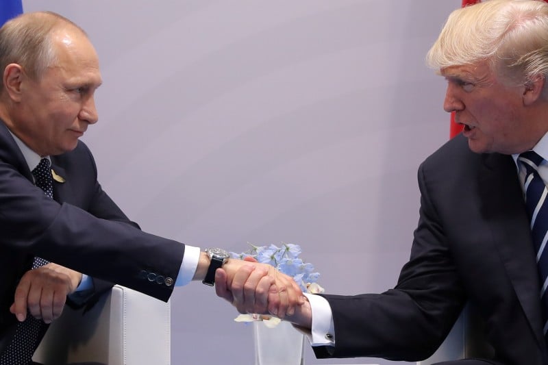 U.S. President Donald Trump shakes hands with Russian President Vladimir Putin during the their bilateral meeting at the G20 summit in Hamburg, Germany July 7, 2017. REUTERS/Carlos Barria