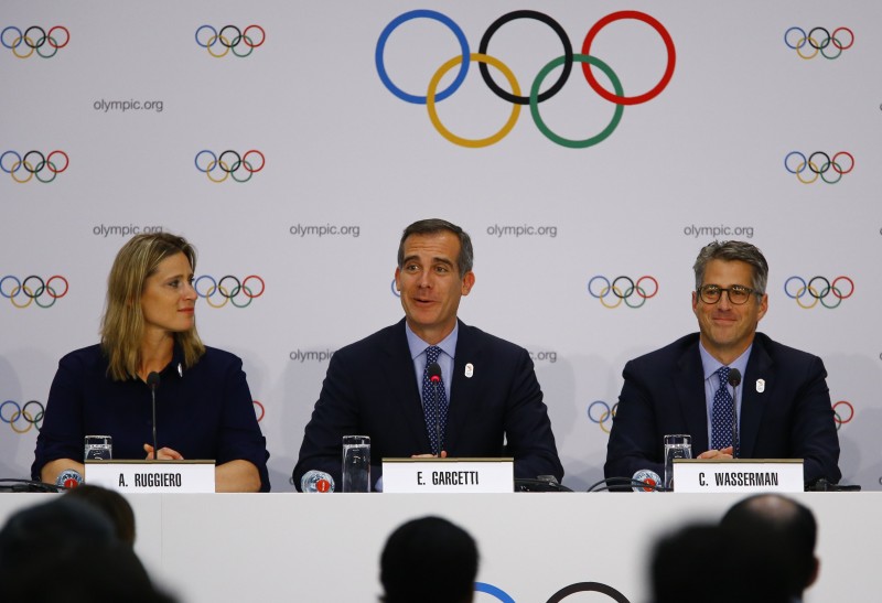 U.S. International Olympic Committee (IOC) member Angela Ruggiero, Mayor of Los Angeles Eric Garcetti and Chairman of the LA 2024 Candidature Committee Casey Wasserman attend the briefing of 2024 Olympic Games candidate cities Paris and Los Angeles ahead of final election of 2024 Olympic host city, in Lausanne, Switzerland July 11, 2017. REUTERS/Pierre Albouy
