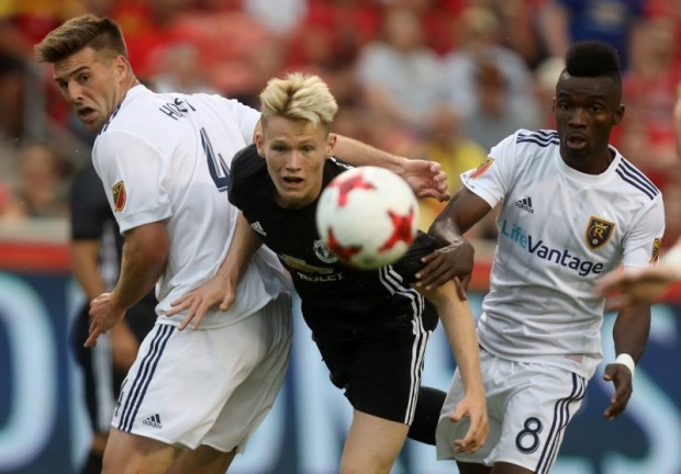 Soccer Football - Real Salt Lake vs Manchester United - Pre Season Friendly - Sandy, USA - July 17, 2017 Manchester United's Scott McTominay in action with Real Salt Lake's Sunday Stephen and David Horst (L) REUTERS/Jim Urquhart