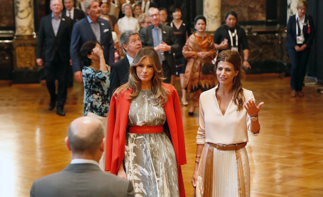 HAMBURG, GERMANY - JULY 08: First Mayor of Hamburg Olaf Scholz receives (background L-R) Melania Trump, wife of US President Donald J. Trump, Joachim Sauer, husband of German Chancellor Angela Merkel, Juliana Awada, wife of the President of Argentina Mauricio Macri and other partners of Heads of State and Governments, plus respresentatives of guest invitees during the partner program of G20 summit on the second day of the G20 summit at Hamburg Town Hall on July 8, 2017 in Hamburg, Germany. Leaders of the G20 group of nations are meeting for the July 7-8 summit. Topics high on the agenda for the summit include climate policy and development programs for African economies. (Photo by Friedemann Vogel - Pool/Getty Images)