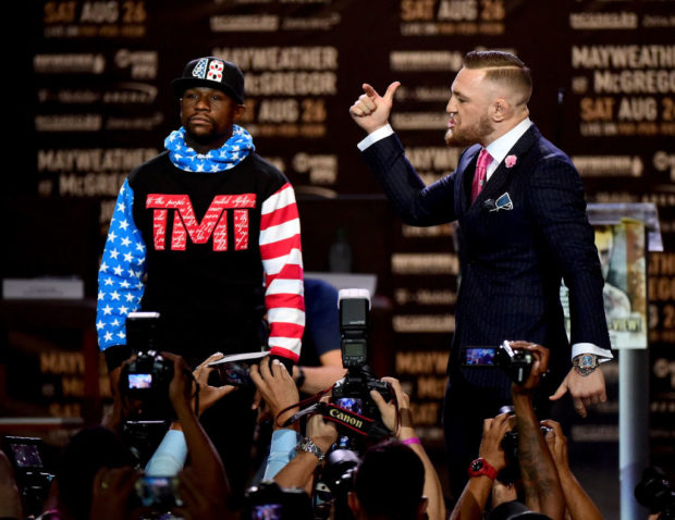Floyd Mayweather Jr. and Conor McGregor faceoff on stage during the Floyd Mayweather Jr. v Conor McGregor World Press Tour at Staples Center on July 11, 2017 in Los Angeles, California. (Photo by Harry How/Getty Images)