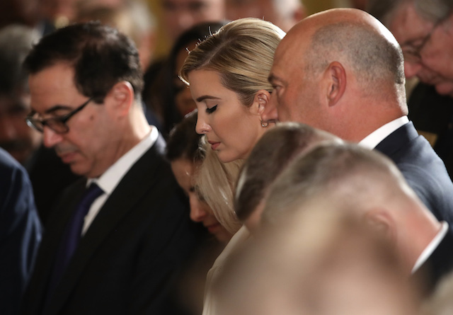 WASHINGTON, DC - JULY 31: Ivanka Trump (C), an advisor to her father U.S. President Donald Trump, bows her head in prayer during a ceremony where Trump presented the Medal of Honor to former Army Specialist James McCloughan of South Haven, Michigan, during an East Room ceremony at the White House July 31, 2017 in Washington, DC. McCloughan is awarded with the medal for his heroic acts as a combat medic during the Vietnam War. (Photo by Win McNamee/Getty Images)
