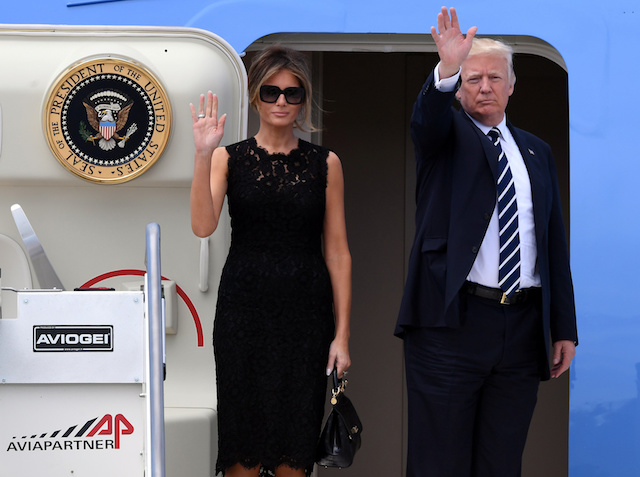 U.S. President Donald Trump and first lady Melania Trump waves before leaves from the Leonardo da Vinci-Fiumicino Airport in Rome, Italy, May 24, 2017. REUTERS/Alberto Lingria FOR EDITORIAL USE ONLY. NO RESALES. NO ARCHIVES - RTX37DYO