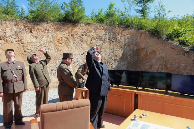 North Korean leader Kim Jong Un looks on during the test-launch of the intercontinental ballistic missile Hwasong-14 in this undated photo released by North Korea's Korean Central News Agency (KCNA) in Pyongyang July 5, 2017. KCNA/via REUTERS