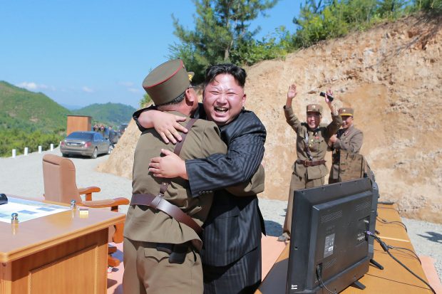 North Korean leader Kim Jong Un reacts with scientists and technicians of the DPRK Academy of Defence Science after the test-launch of the intercontinental ballistic missile Hwasong-14 in this undated photo released by North Korea's Korean Central News Agency (KCNA) in Pyongyang July, 5, 2017. KCNA/via REUTERS 