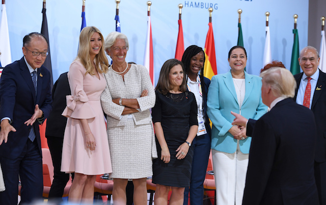 US President Donald Trump (2nd R) jokes as his daughter Ivanka Trump (2nd L) poses with participants of the panel discussion "Launch Event Women's Entrepreneur Finance Initiative" on the second day of the G20 Summit in Hamburg, Germany, July 8, 2017. REUTERS/Patrik STOLLARZ/Pool - RTX3AM7N