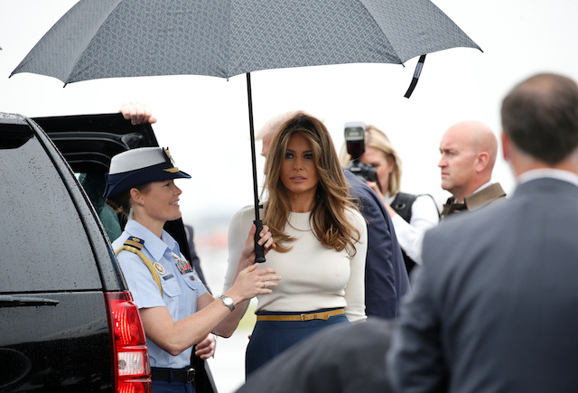 U.S. First Lady Melania Trump has an umbrella held for her as she steps from Air Force One with U.S. President Donald Trump upon their arrival in Newark, New Jersey, U.S. to spend the weekend in Bedminster July 14, 2017. REUTERS/Kevin Lamarque - RTX3BIOG
