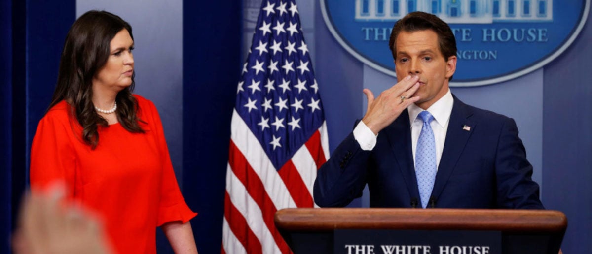 New White house Communications Director Anthony Scaramucci (R)), flanked by White House Press Secretary Sarah Sanders, blows a kiss to reporters after addressing the daily briefing at the White House in Washington, U.S. July 21, 2017. REUTERS/Jonathan Ernst