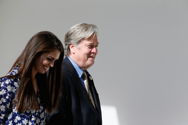 White House Chief Strategist Steve Bannon and White House Director of Strategic Communications Hope Hicks walk along the colonnade ahead of a joint press conference by Japanese Prime Minister Shinzo Abe and U.S. President Donald Trump at the White House in Washington, February 10, 2017. REUTERS/Jim Bourg