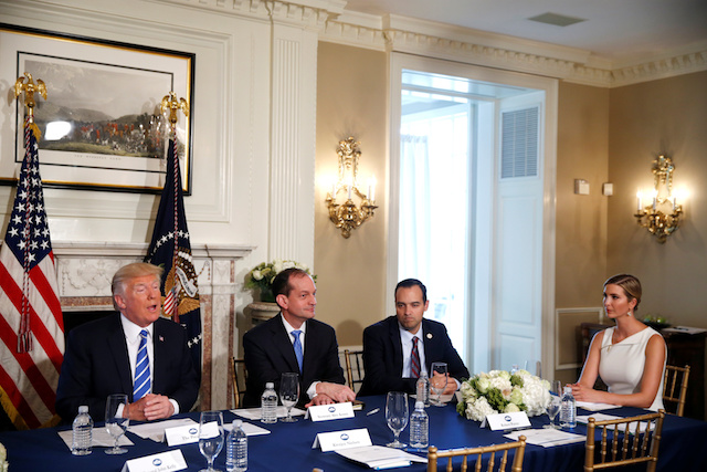 U.S. President Donald Trump (L) sits with (L-R) Labor Secretary Alex Acosta, Assistant to the President and Director of the Domestic Policy Council Andrew Bremberg and his daughter and Advisor to the President Ivanka Trump as he speaks to reporters during a workforce and economic discussion where he addressed questions about North Korea at his golf estate in Bedminster, New Jersey U.S. August 11, 2017. REUTERS/Jonathan Ernst - RTS1BEVQ