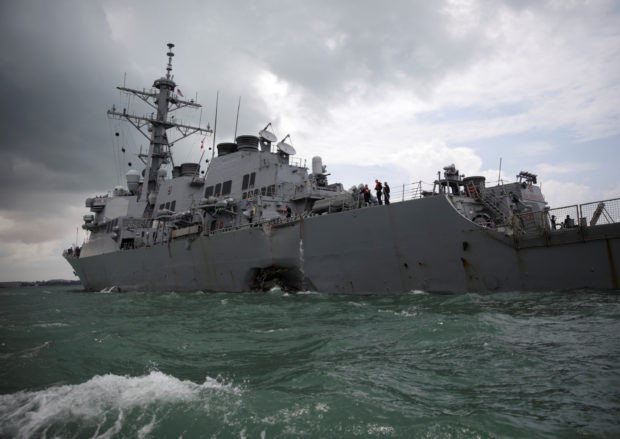 The U.S. Navy guided-missile destroyer USS John S. McCain is seen after a collision, in Singapore waters August 21, 2017. REUTERS/Ahmad Masood