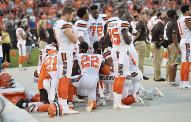 Aug 21, 2017; Cleveland, OH, USA; Members of the Cleveland Browns kneel during the national anthem before a game against the New York Giants at FirstEnergy Stadium. Mandatory Credit: Ken Blaze-USA TODAY Sports/Via Reuters - RTS1CQO6