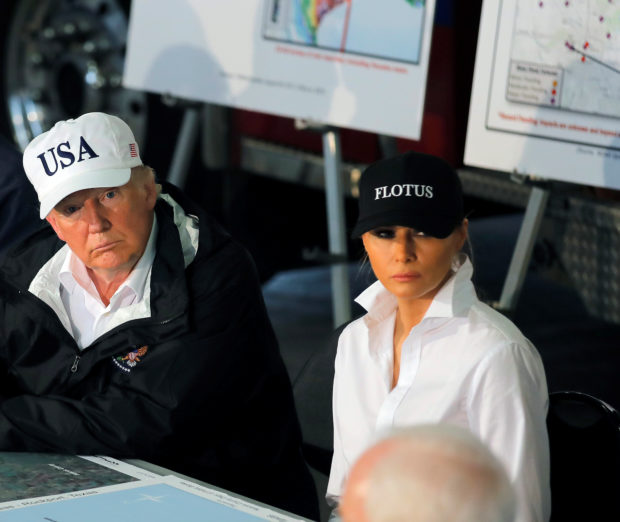 U.S. President Donald Trump and first lady Melania Trump receive a briefing on Tropical Storm Harvey relief efforts with Texas Governor Greg Abbott (L) in Corpus Christi, Texas, U.S., August 29, 2017. REUTERS/Carlos Barria - RTX3DVLB