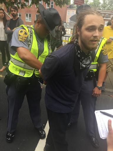 A counter-protester is arrested by Virginia State Police in Charlottesville. (Henry Rodgers, TheDCNF)