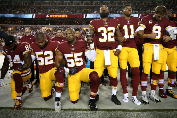 LANDOVER, MD - SEPTEMBER 24: Outside linebacker Ryan Anderson #52 and linebacker Chris Carter #55 of the Washington Redskins during the the national anthem before the game against the Oakland Raiders at FedExField on September 24, 2017 in Landover, Maryland. (Photo by Patrick Smith/Getty Images)