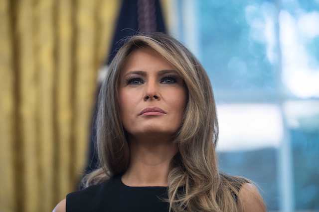 US First Lady Melania Trump looks on as President Donald Trump speaks after receiving an update from disaster relief organizations on Hurricane Harvey recovery efforts in the Oval Office at the White House in Washington, DC, on September 1, 2017. / AFP PHOTO / NICHOLAS KAMM (Photo credit should read NICHOLAS KAMM/AFP/Getty Images)